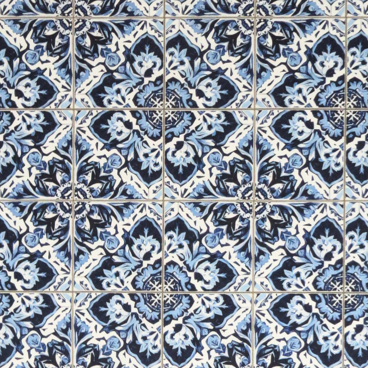 Decorative blue and white patterned tea towel on a white background