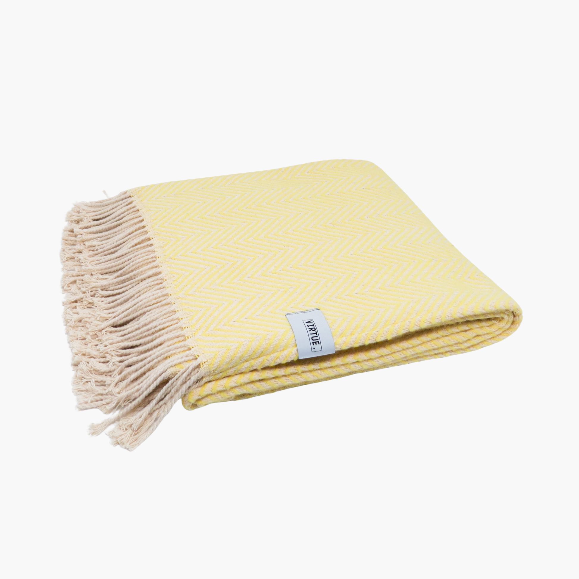 Yellow throw blanket with fringed edge on a white background