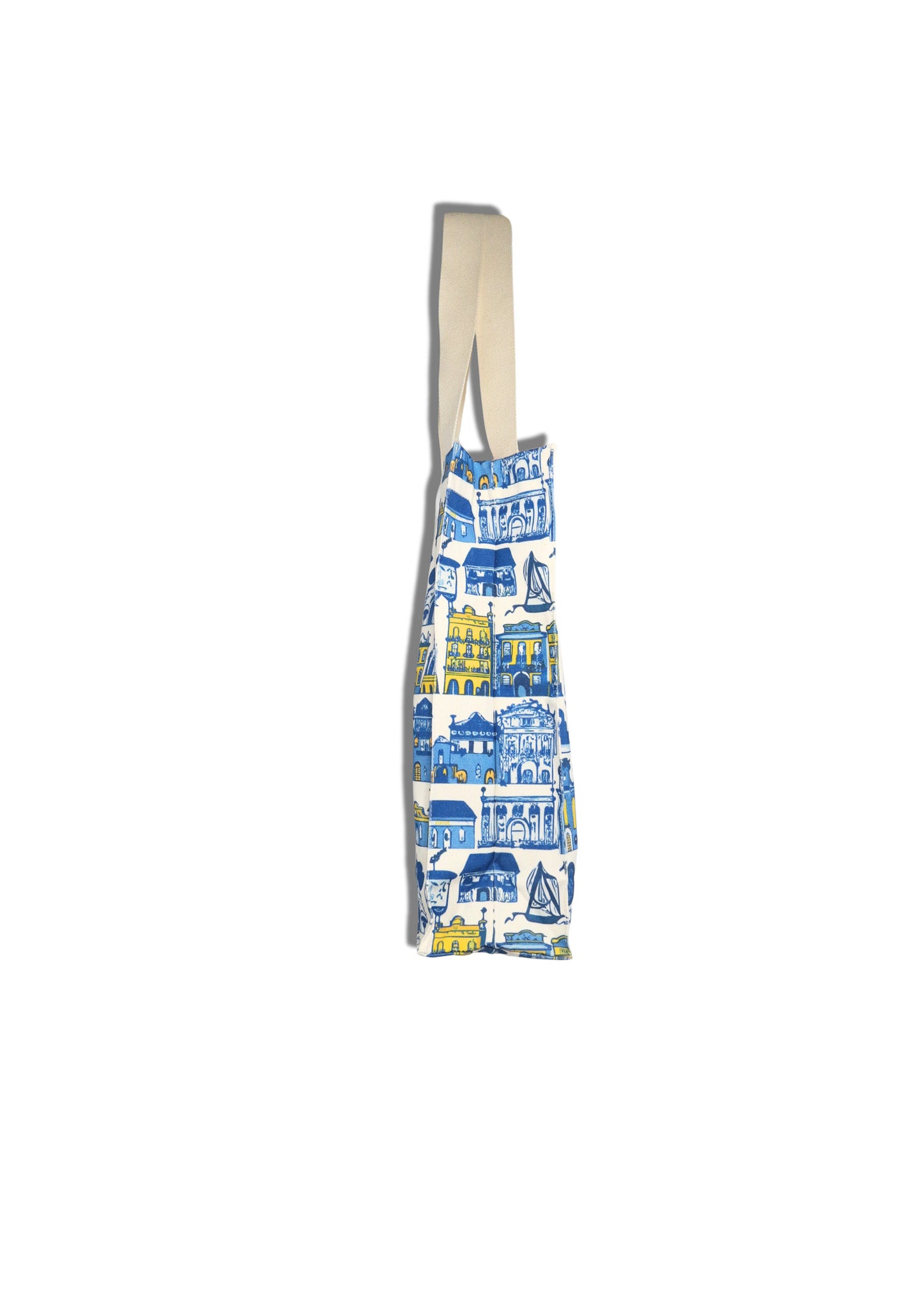Tote bag with blue and yellow cityscape design on a white background